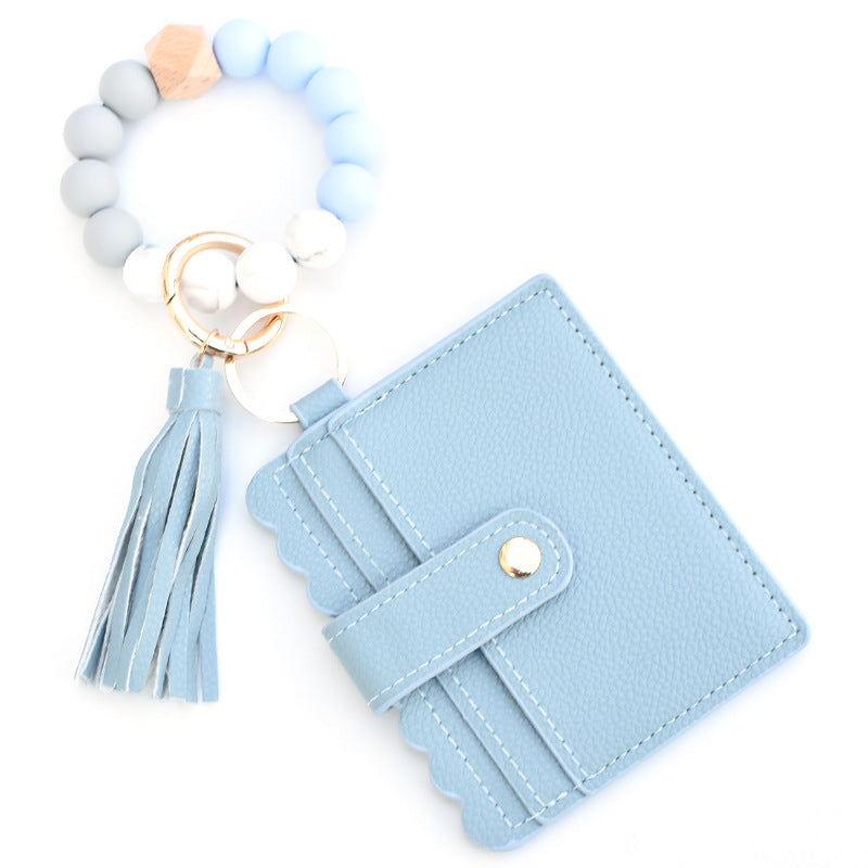 Llavero colorido al por mayor de la muñeca del monedero de la borla de la PU de los granos del silicón